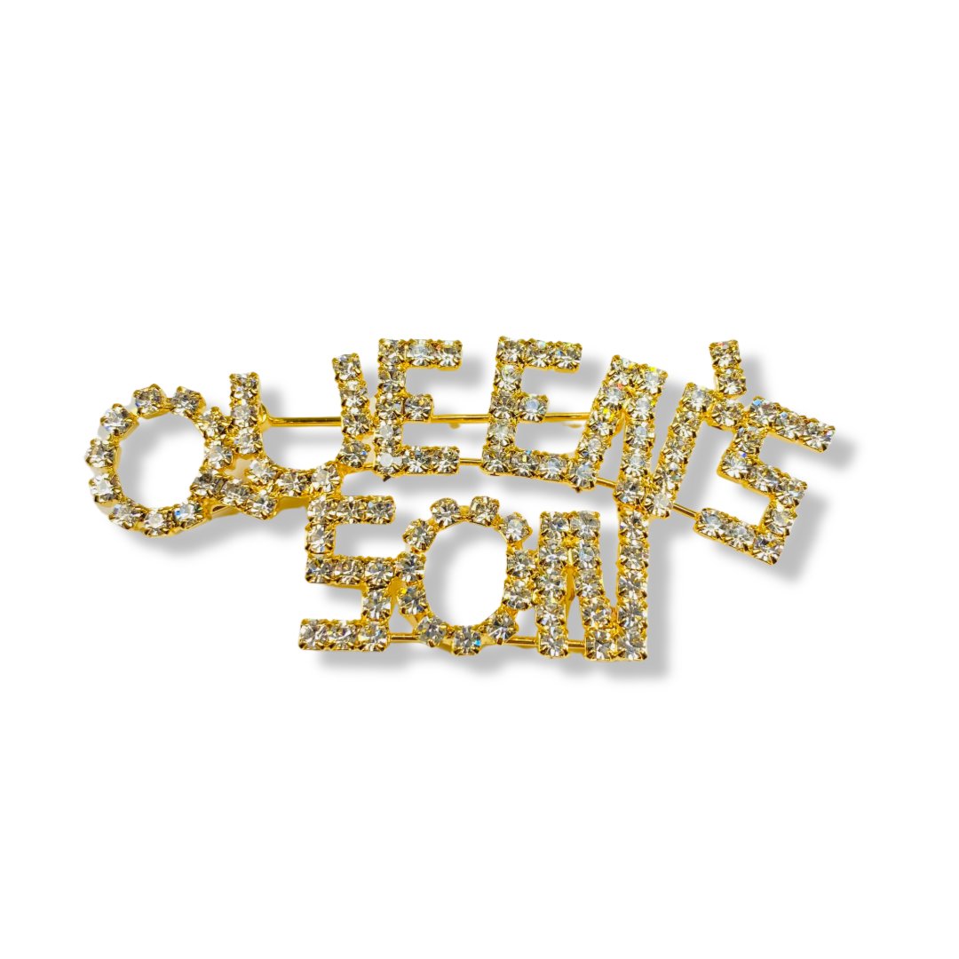“Queens Son” rhinestone pin.